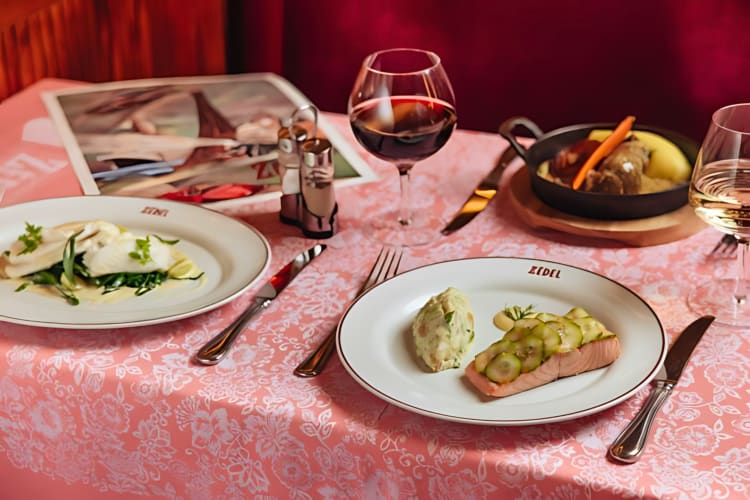 At this french bistro style romantic restaurant in London, try the salmon topped with cucumber, salad and wine. 