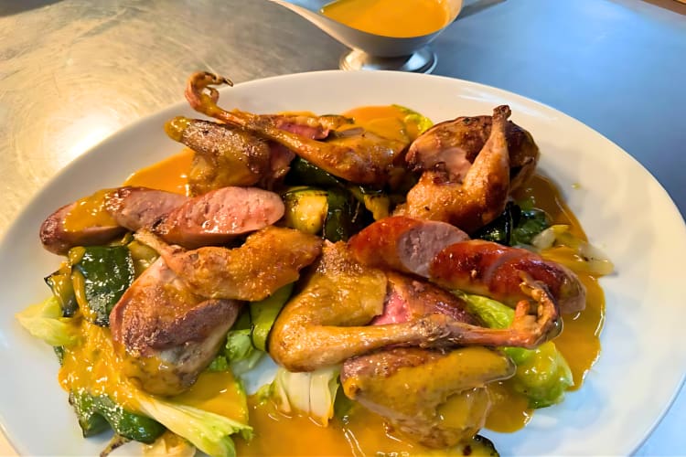 Steak and chicken with peppercorn sauce can be found at this romantic restaurant in London. 