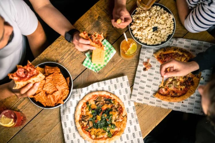 At this team building activity in London you can fill up on pizza, burgers and more.