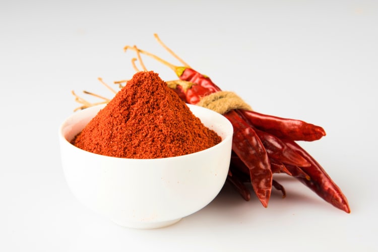 Essential to all list of spices, chili powder is made from chilies and is often dark red in color. 