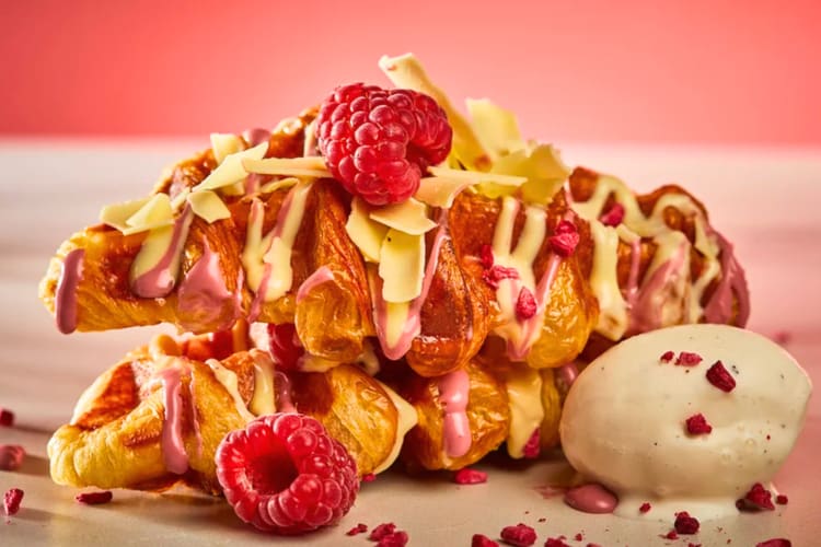 For a sweet dessert in London try this rasberry covered croissant with white chocolate and raspberry sauce and ice cream on the side. 