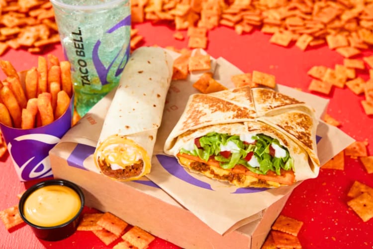 A Big Cheez-It Box featuring a Big Cheez-It Crunchwrap Supreme, a Beefy 5-Layer Burrito, Nacho Fries with nacho cheese sauce and a medium fountain drink is one of the Taco Bell new items to try. 