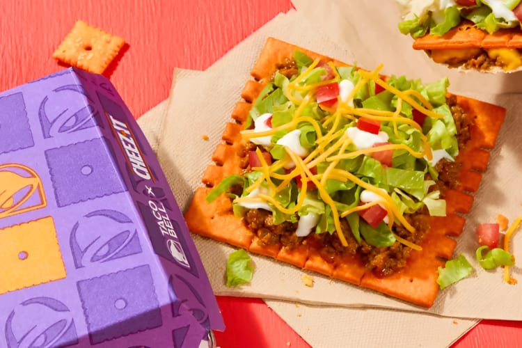  A Big Cheez-It Tostada topped with seasoned beef, lettuce, tomatoes, shredded cheese and sour cream is a Taco Bell New item to try. 
