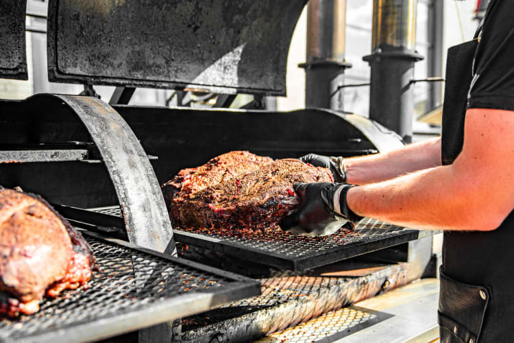 Brisket in a smoker. 