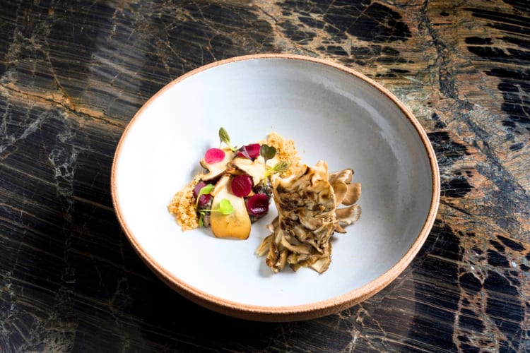 Try the oven-roasted hen dish at this Michelin star restaurant in Barcelona.