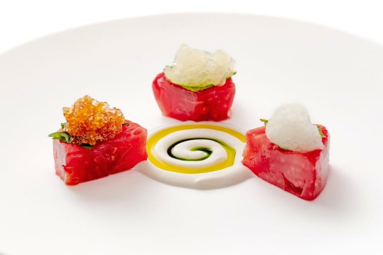 Tomato with salad and Parmesan at this Michelin star restaurant in Barcelona