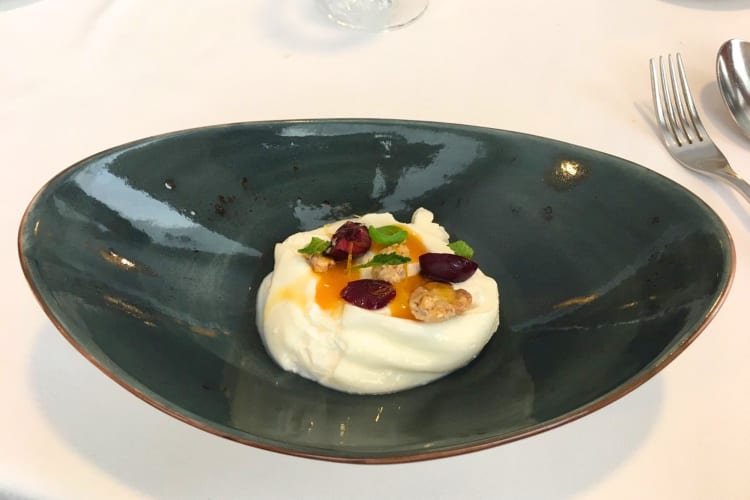 Try cream with fruit at this Michelin star restaurant in Barcelona.