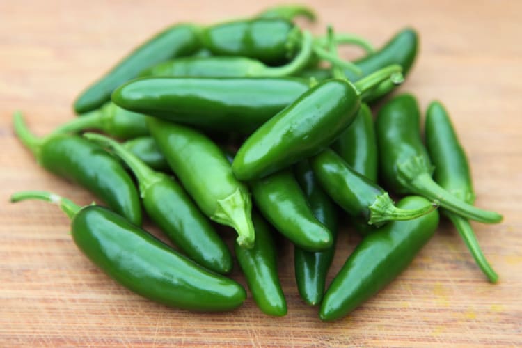 A pile of jalapeño peppers.