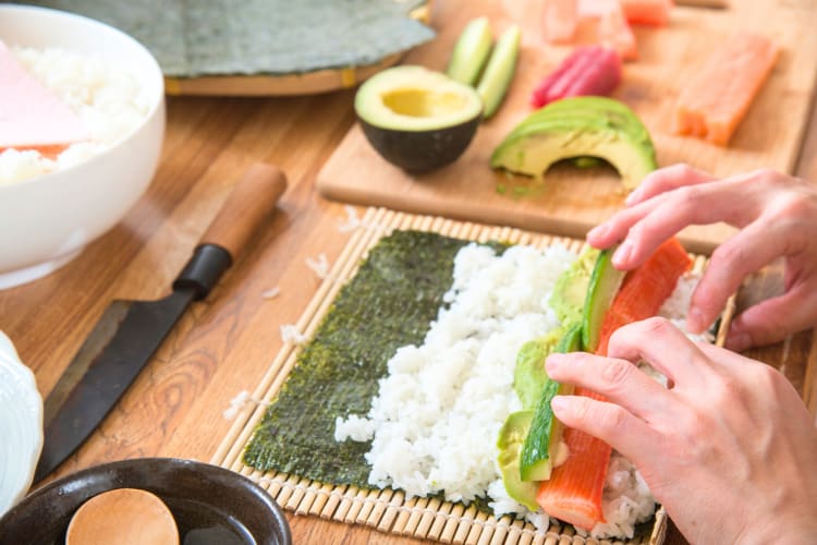 Learn how to make Kanpachi sushi at a cooking class. 
