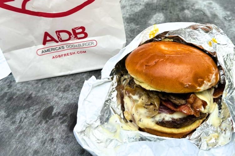 This fast food Chicago burger is stuffed with beef patties, bacon, cheese and more.  