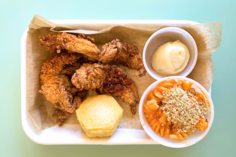 At this fast food Chicago spot try the honey butter chicken with biscuits and mac and cheese. 