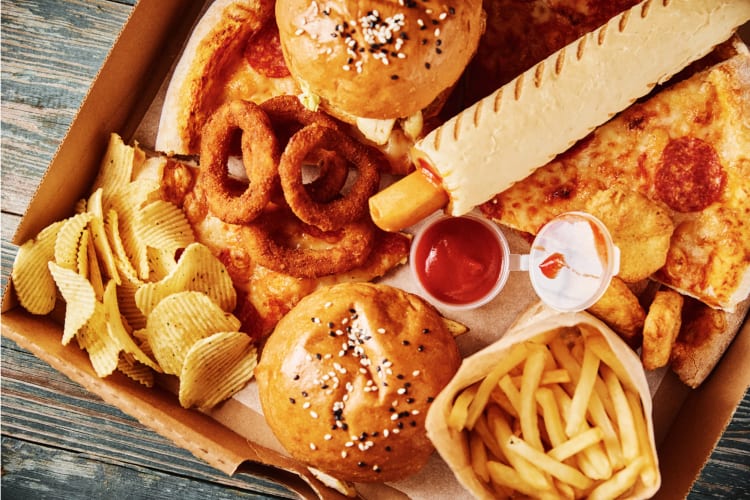 Fast food including burgers, hot dogs, chips, onion rings and fries. 