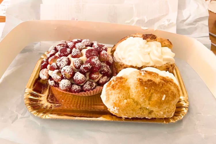 A strawberry tart and Bigne con Pana can be found at this restaurant in Rome.