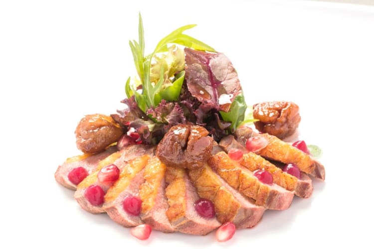 At this Roman restaurant order pork belly, berries and sauce.