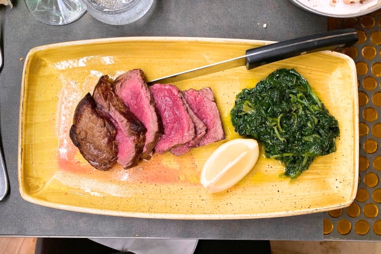 At this Roman restaurant try medium rare steak with spinach. 