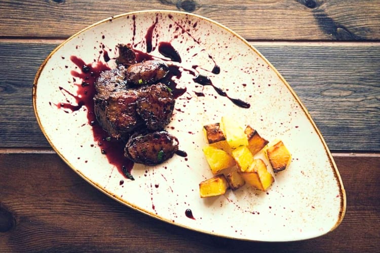 Order steak with potatoes at this unique restaurant in Rome. 