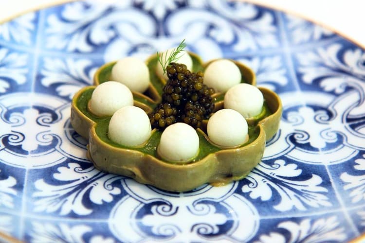 At this Madrid restaurant order cheese balls and caviar set in a beautiful flower casing. 