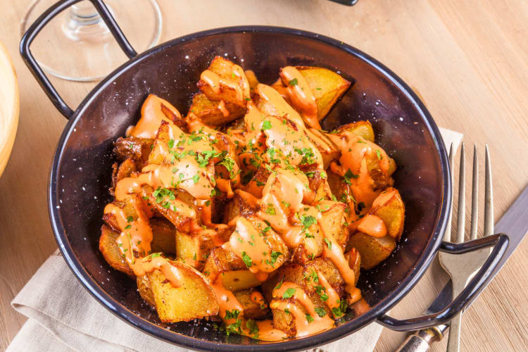 This Barcelona food is made of potatoes and smothered in a special sauce.