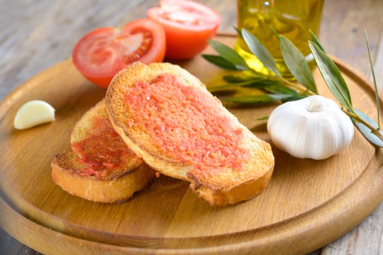 This Barcelona food is fried bread topped with tomato. 