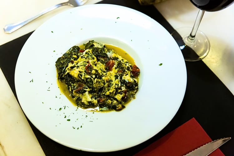 This Barcelona food uses fresh spinach which is sautéed in olive oil with raisins and toasted pine nuts.