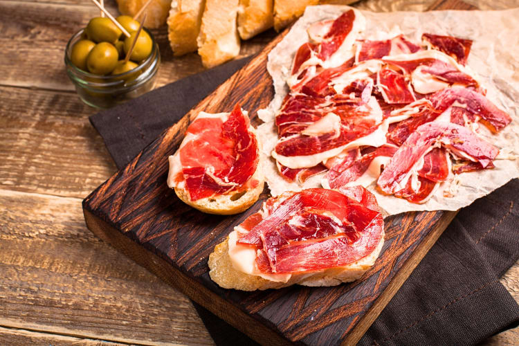 A much loved Barcelona food, jamón Ibérico is made from acorn-fed, free-roaming pigs and cured for 30 to 60 months, resulting in thin, translucent slices with a marbled fat content.