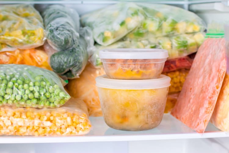 Frozen vegetables in freezer bags, including corn, broccoli, peas and more.