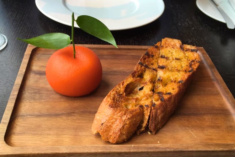 A 'meat fruit' dish, a chicken parafait that looks like a fresh orange, can be found at this Michelin star restaurant in London.