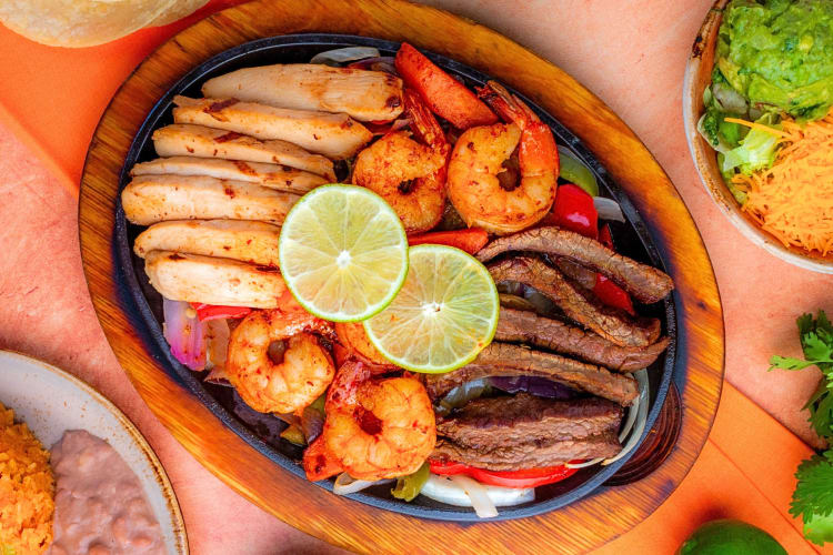 Aerial view of a meal with steak, chicken and shrimp, from Azteca D’Oro