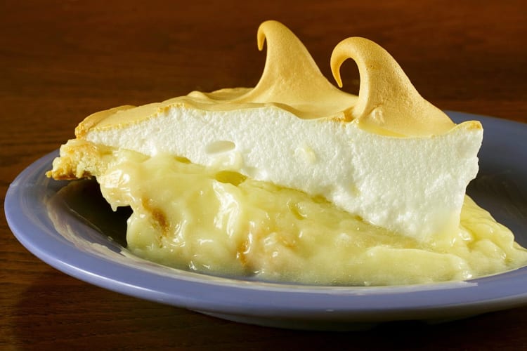 Close-up view of a slice of lemon meringue pie from Babe’s Chicken Dinner House