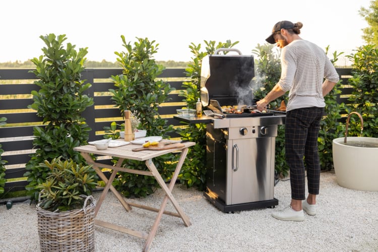 A person barbecuing