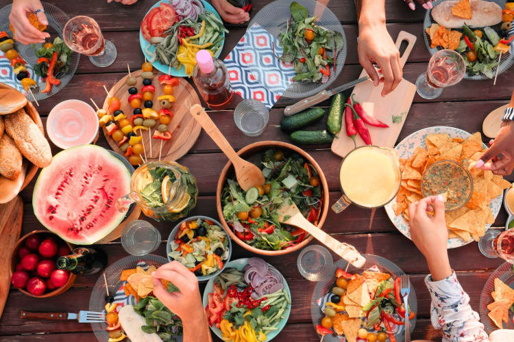 Planning a seasonal potluck is a fun backyard party idea