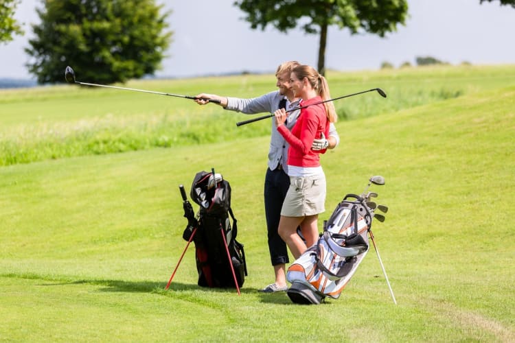 Going golfing is a fun outdoor date idea in Baltimore