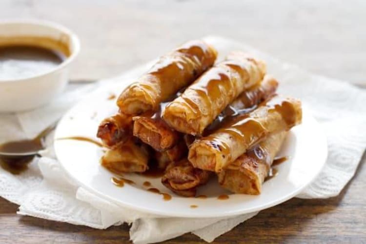 banana lumpia with coconut caramel sauce is an homage to an iconic filipino treat