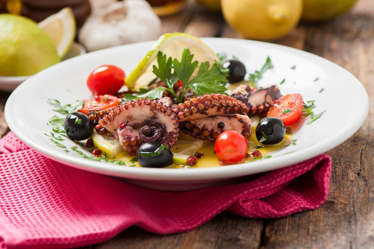 An octopus, olive and tomato dish