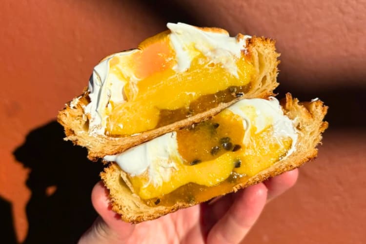 A pastry with cream and passionfruit purée
