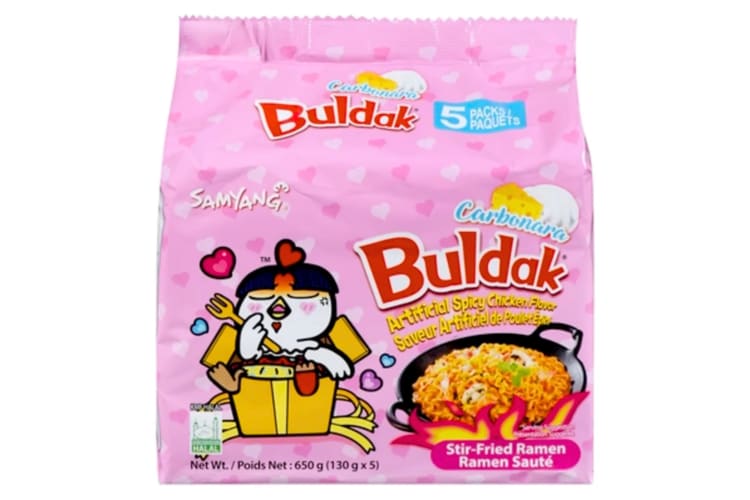 A pink bag of instant ramen noodles with a love hearts design