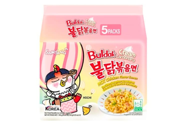 A pink bag of instant noodles with a character in a hot air balloon