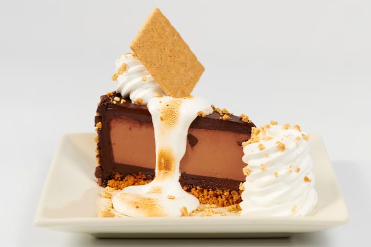 A slice of Toasted Marshmallow S’mores Galore from The Cheesecake Factory