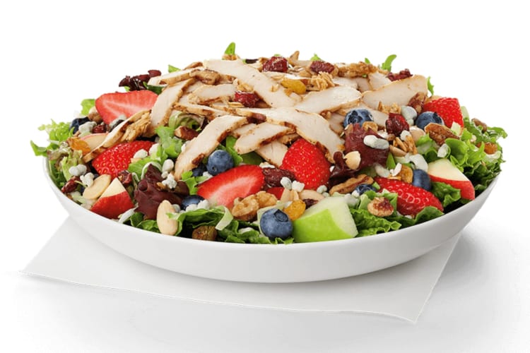 A salad with grilled chicken