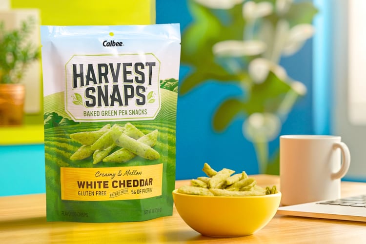 A bag and bowl of Harvest Snaps snap pea crisps