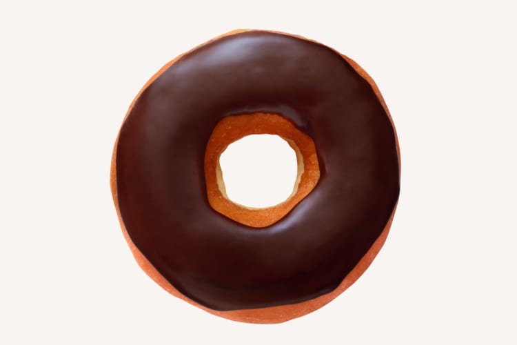 A chocolate frosted ring donut