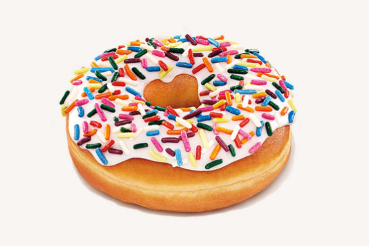 A vanilla frosted donut with colorful sprinkles