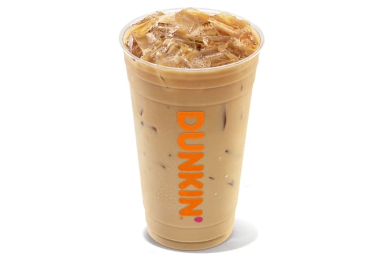 A Dunkin' Donuts clear cup with iced coffee