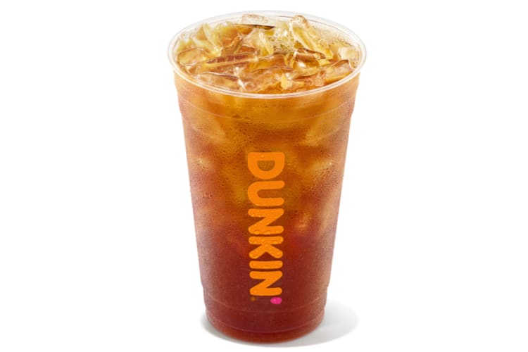 A clear cup with iced tea