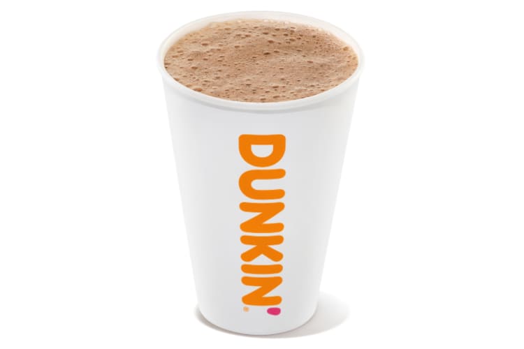 A Dunkin' white paper cup with hot chocolate