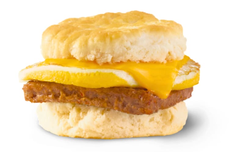 A biscuit with eggs, cheese and sausage patty