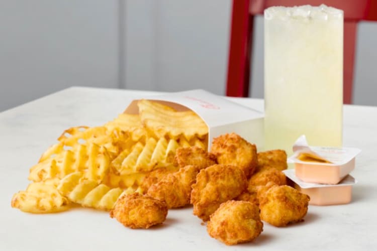 Chicken nuggets, waffle fries and lemonade