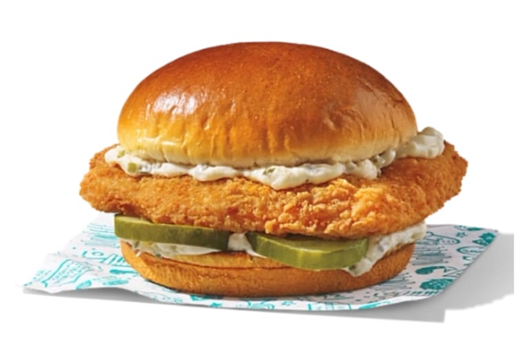 Battered fish, pickles and tartare sauce in a bun