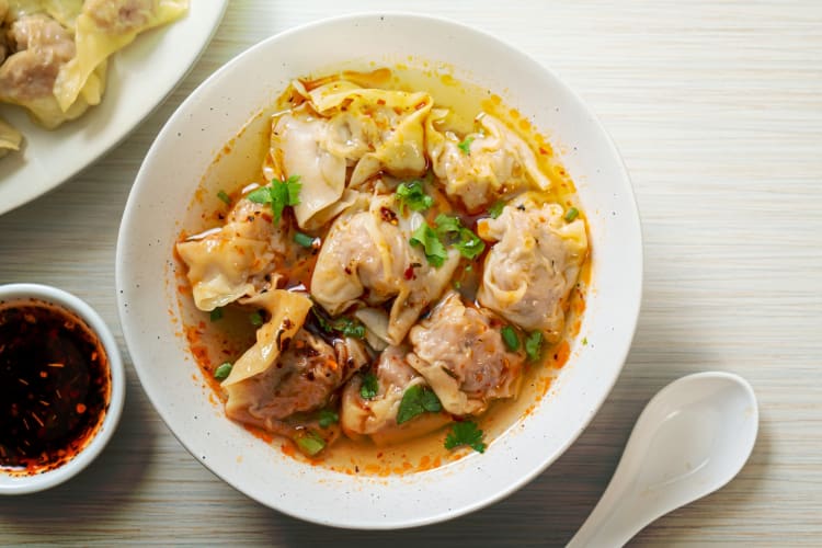 Pork soup dumplings with broth and chile pepper