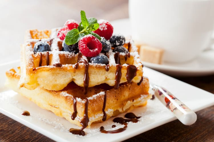 Waffles with berries and chocolate sauce